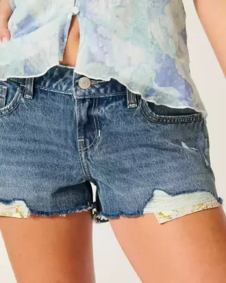 Low-Rise Distressed Medium Wash Denim Mini Shorts