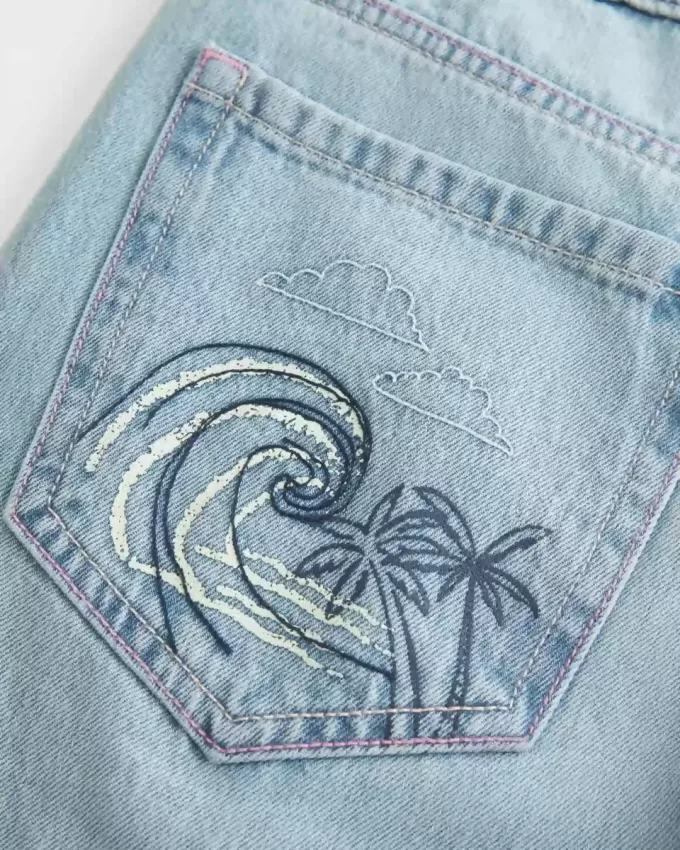 Low-Rise Ripped Light Wash Graphic Baggy Jeans