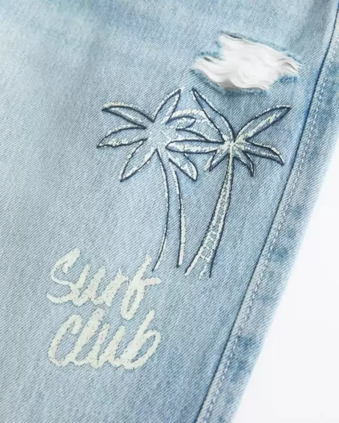 Low-Rise Ripped Light Wash Graphic Baggy Jeans