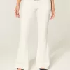 Ultra Low-Rise White Embroidered Pocket Flare Jeans