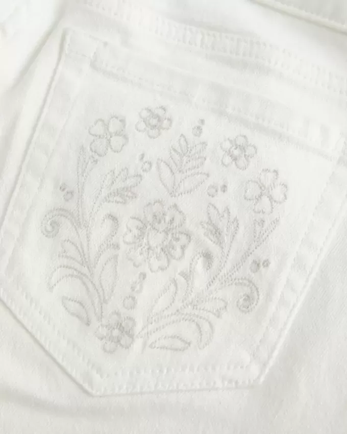 Ultra Low-Rise White Embroidered Pocket Flare Jeans